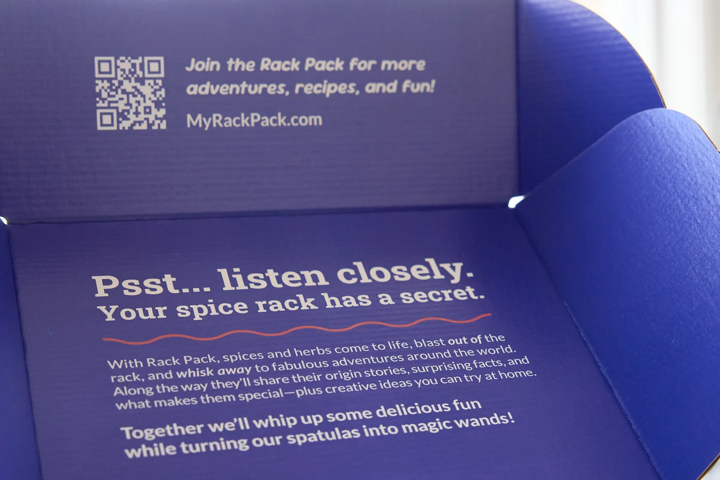 The box lid opened, showing the message printed on the inside